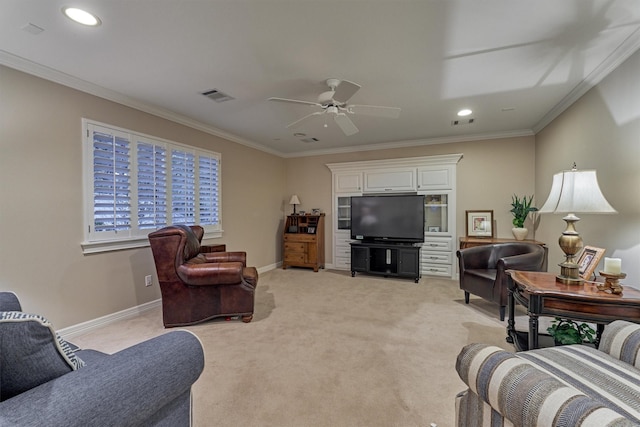 living area with light carpet, visible vents, baseboards, and ornamental molding