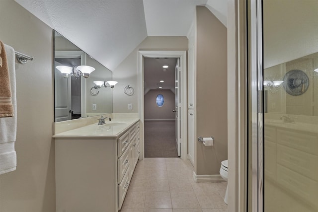 full bathroom featuring vanity, lofted ceiling, tile patterned flooring, toilet, and a shower with door