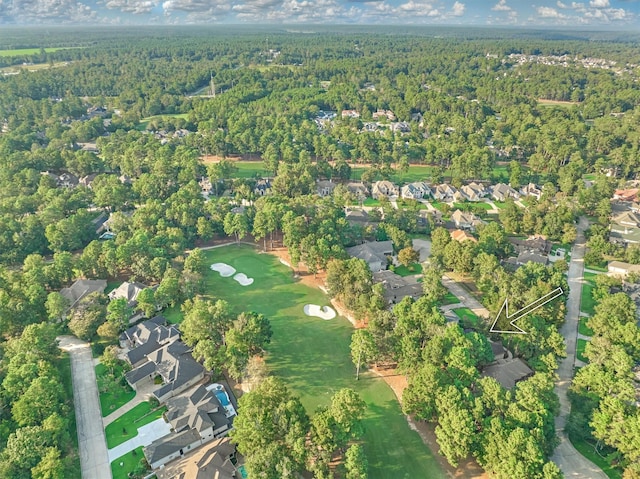 birds eye view of property featuring a residential view and a wooded view