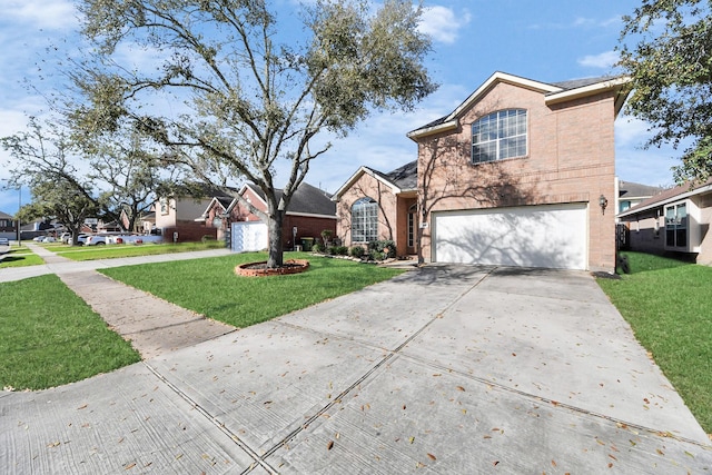 traditional-style house featuring a garage, driveway, brick siding, and a front yard