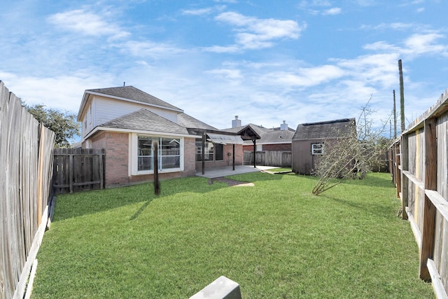 view of yard with a patio, an outbuilding, a fenced backyard, and a shed