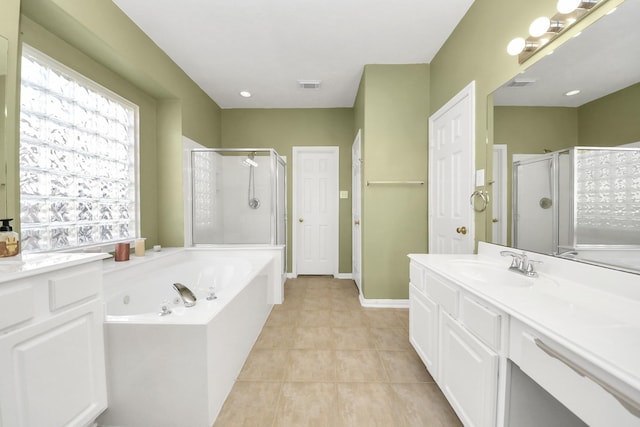 bathroom featuring tile patterned floors, a bath, visible vents, and a stall shower