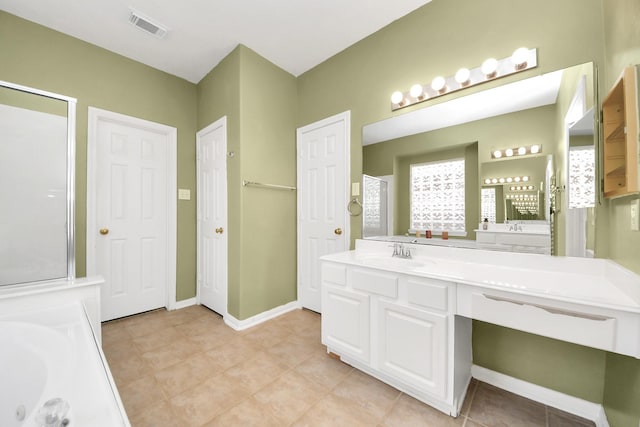 bathroom featuring vanity, baseboards, visible vents, and a shower with door