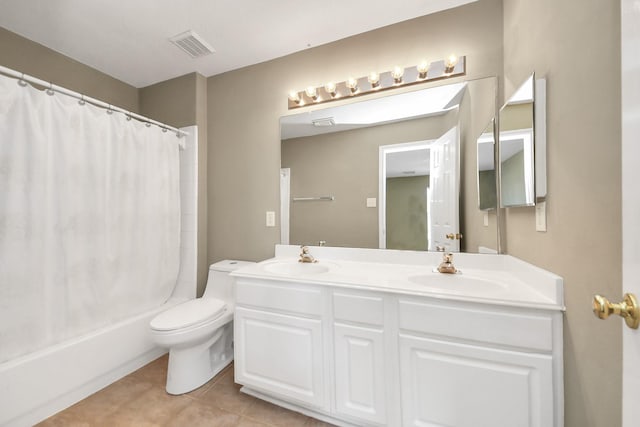 full bathroom featuring tile patterned floors, visible vents, double vanity, and a sink