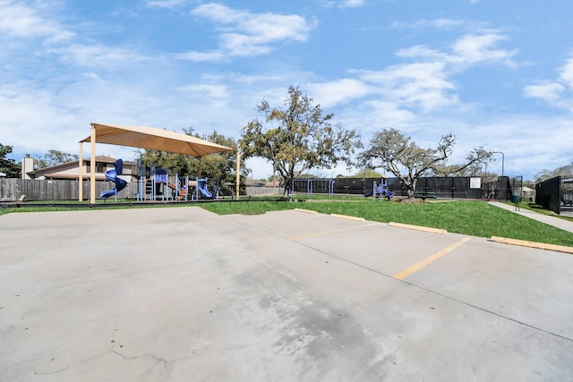 exterior space with playground community and fence