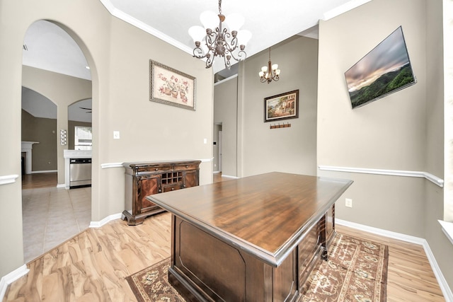 office area with a notable chandelier, arched walkways, baseboards, and ornamental molding