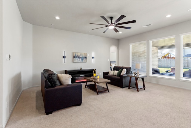 living room with visible vents, recessed lighting, light colored carpet, and ceiling fan