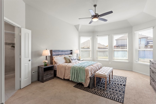 bedroom with light carpet, baseboards, lofted ceiling, and a ceiling fan