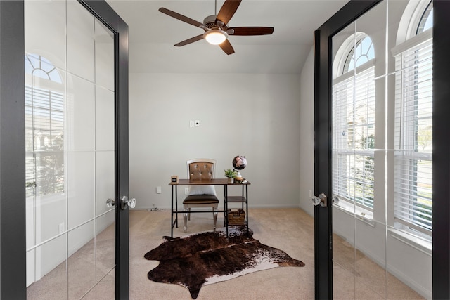 office area with french doors, ceiling fan, and vaulted ceiling