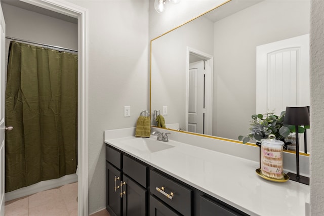 bathroom featuring vanity, a shower with curtain, and tile patterned flooring