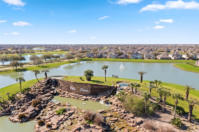 birds eye view of property featuring a residential view and a water view