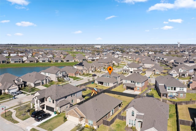 birds eye view of property with a residential view and a water view