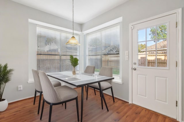 dining area with wood finished floors and baseboards