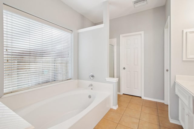 bathroom featuring vanity, a garden tub, visible vents, a stall shower, and tile patterned floors