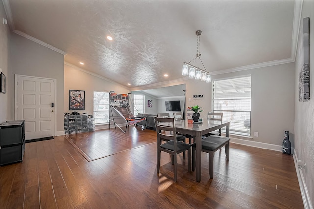 dining room featuring crown molding, dark wood-type flooring, baseboards, and vaulted ceiling