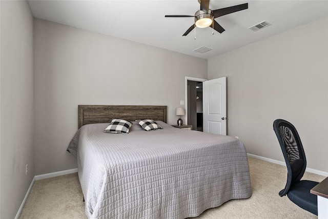 carpeted bedroom featuring visible vents, a ceiling fan, and baseboards