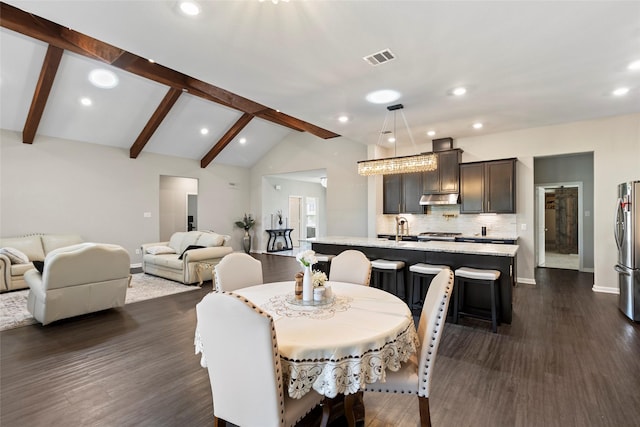 dining area with dark wood finished floors, vaulted ceiling with beams, baseboards, and visible vents