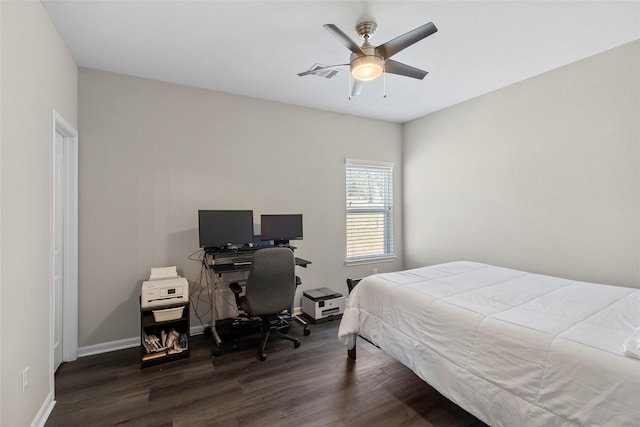 bedroom featuring ceiling fan, baseboards, and wood finished floors