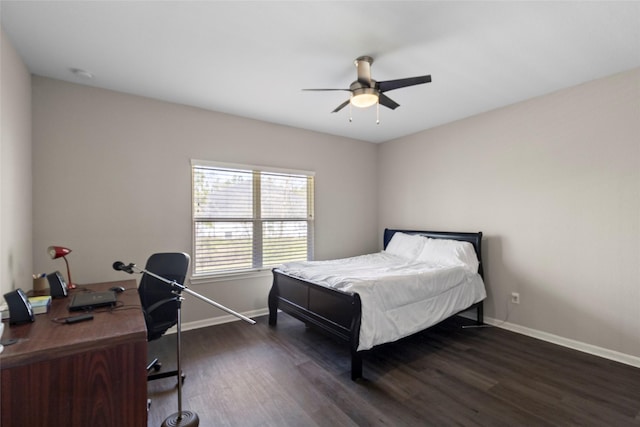 bedroom with baseboards, dark wood-style floors, and a ceiling fan