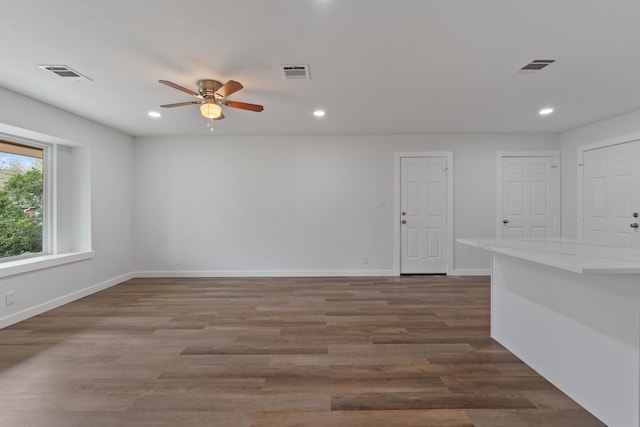 unfurnished room with visible vents and wood finished floors