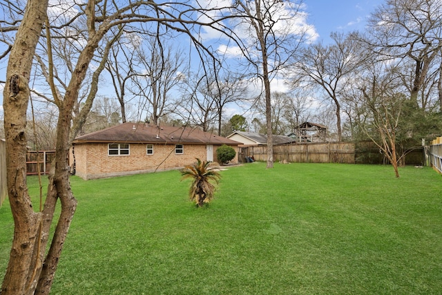 view of yard featuring a fenced backyard