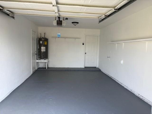 garage featuring a garage door opener and water heater