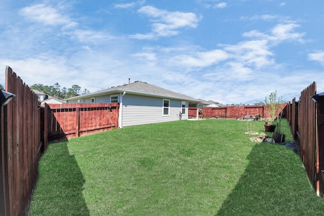 view of yard featuring a fenced backyard