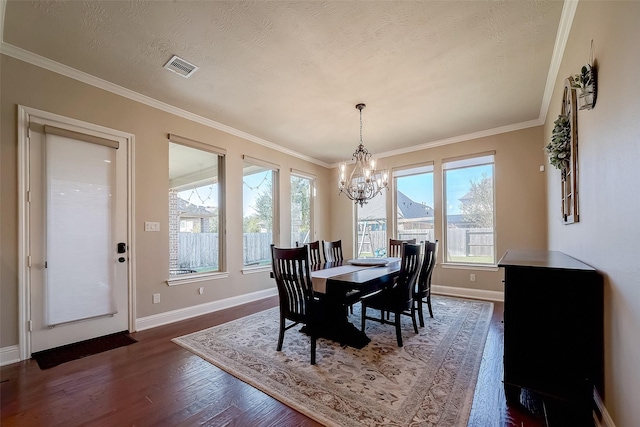 dining room with visible vents, baseboards, dark wood-style floors, and ornamental molding