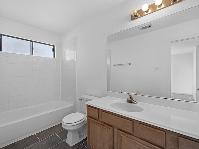 full bath with visible vents, washtub / shower combination, toilet, tile patterned floors, and vanity