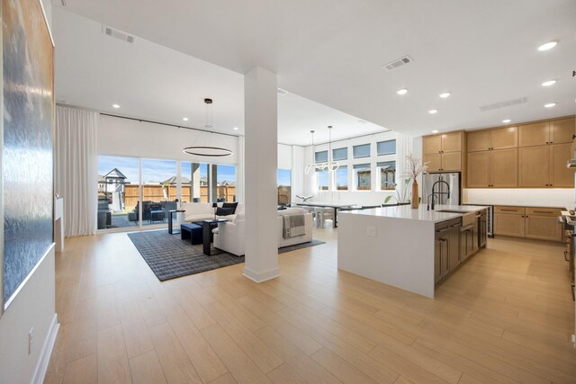 kitchen featuring visible vents, recessed lighting, and light wood-style flooring