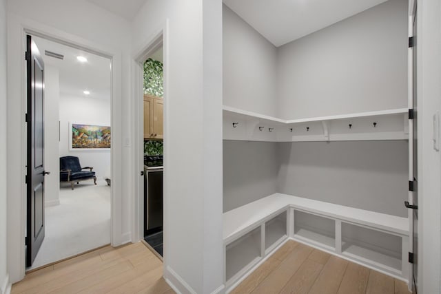 mudroom with visible vents and light wood-type flooring