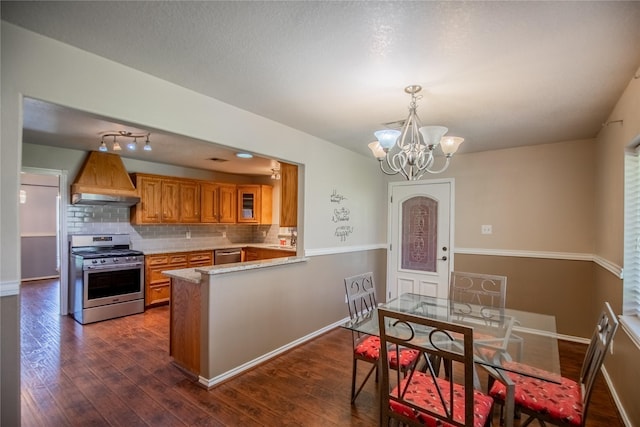 kitchen featuring custom range hood, dark wood-style floors, stainless steel appliances, a peninsula, and brown cabinetry