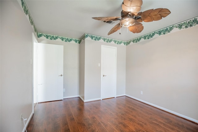 unfurnished bedroom with ceiling fan, visible vents, baseboards, and hardwood / wood-style floors