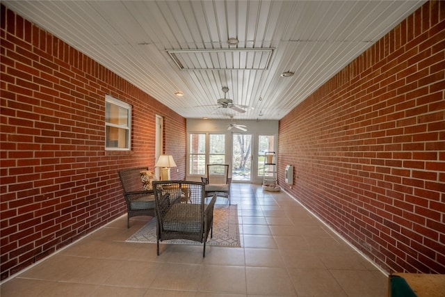 sunroom / solarium with ceiling fan