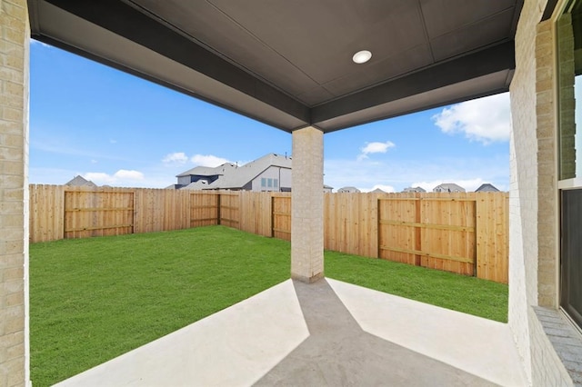 view of yard with a patio and a fenced backyard