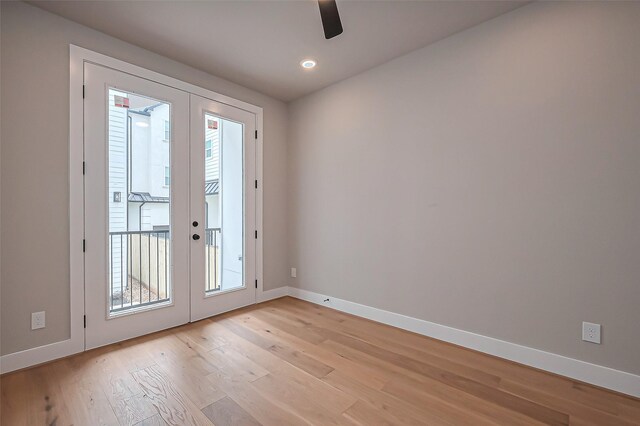 interior space featuring a ceiling fan, recessed lighting, french doors, light wood-style floors, and baseboards