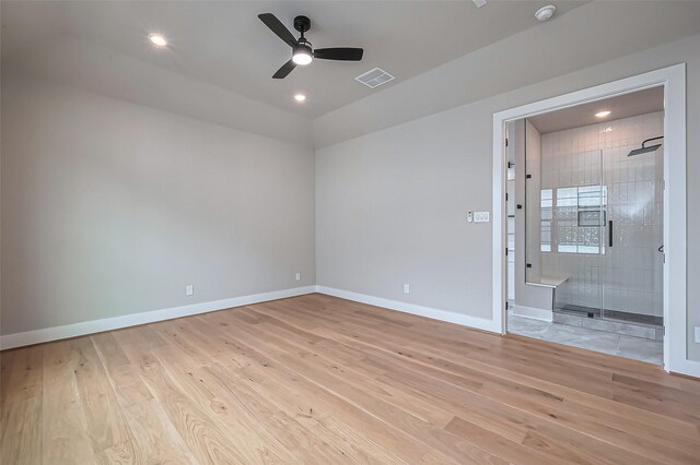 unfurnished room featuring a ceiling fan, baseboards, visible vents, and light wood-type flooring