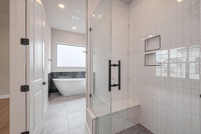 full bathroom with a freestanding tub, visible vents, recessed lighting, a shower stall, and tile patterned flooring