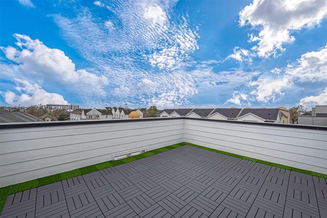 view of patio / terrace with a residential view and a balcony