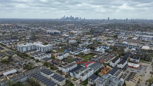 birds eye view of property featuring a city view