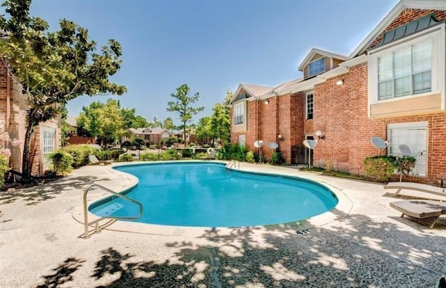 pool featuring a patio