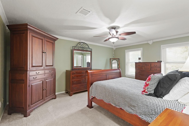 bedroom with visible vents, a ceiling fan, crown molding, baseboards, and light colored carpet