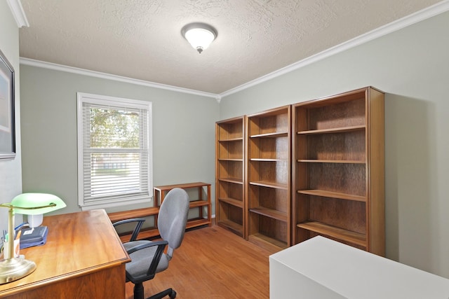 office area featuring light wood-style floors, crown molding, and a textured ceiling