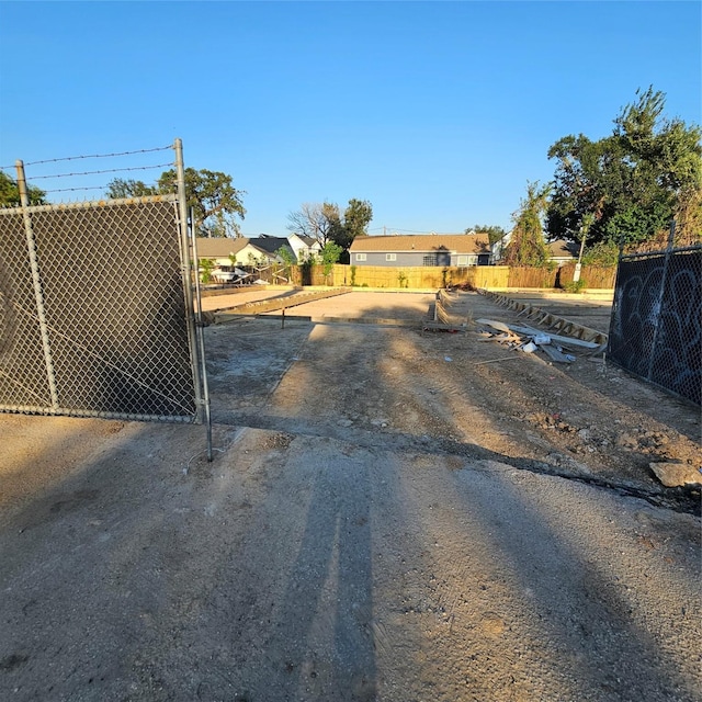 view of yard with a gate and fence