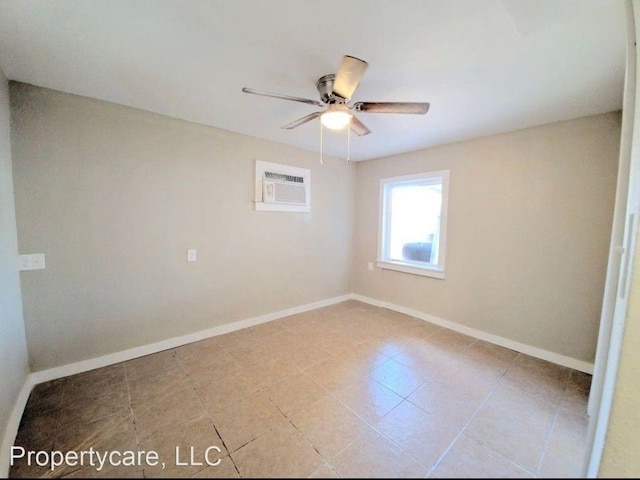 unfurnished room featuring ceiling fan, a wall mounted AC, and baseboards