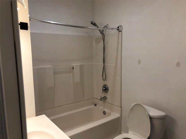 bathroom featuring toilet and shower / washtub combination