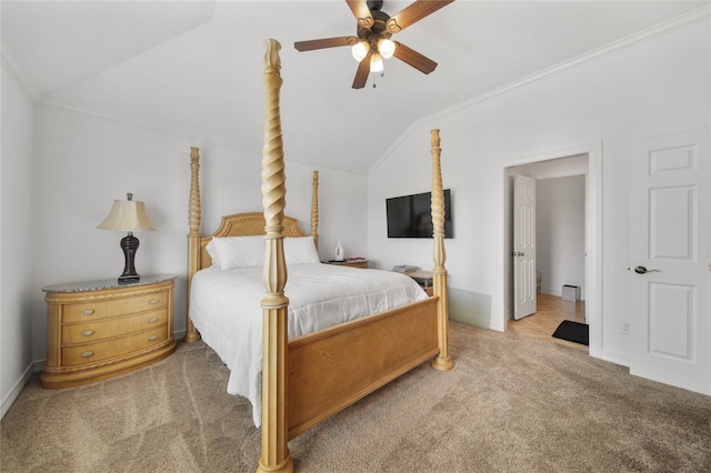 bedroom with ceiling fan, vaulted ceiling, carpet, and ornamental molding