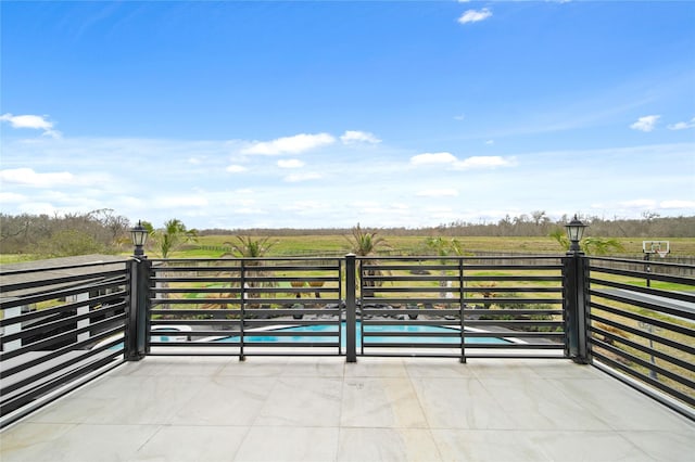 view of patio / terrace featuring a rural view