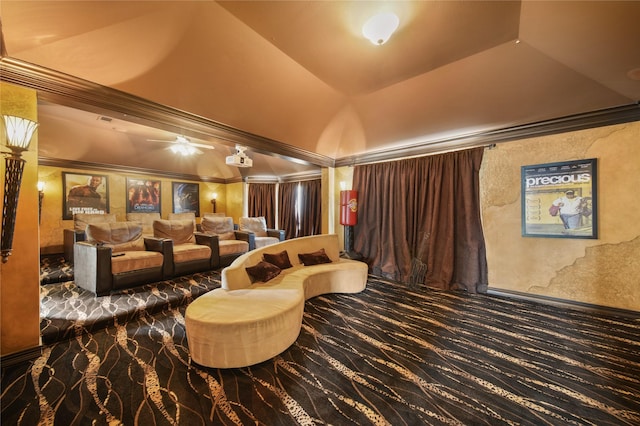 home theater featuring lofted ceiling, a ceiling fan, and crown molding