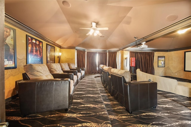 cinema room with a ceiling fan and vaulted ceiling